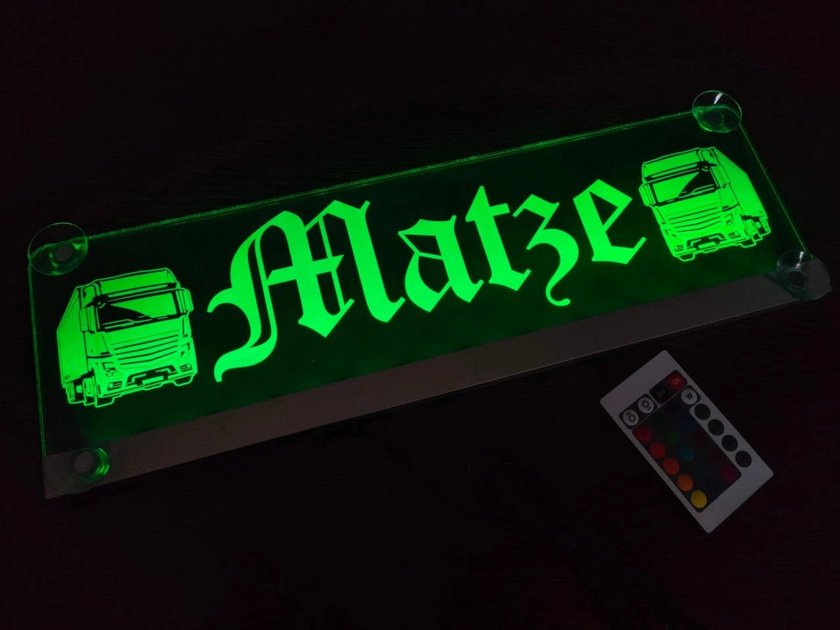 Illuminated LED truck nameplate with "Matze" and truck design, featuring green lighting and suction cup mounts, ideal for LKW cabs.