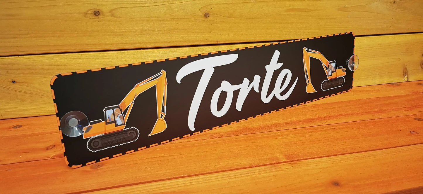 Custom LKW nameplate with digger design, displayed against wooden background
