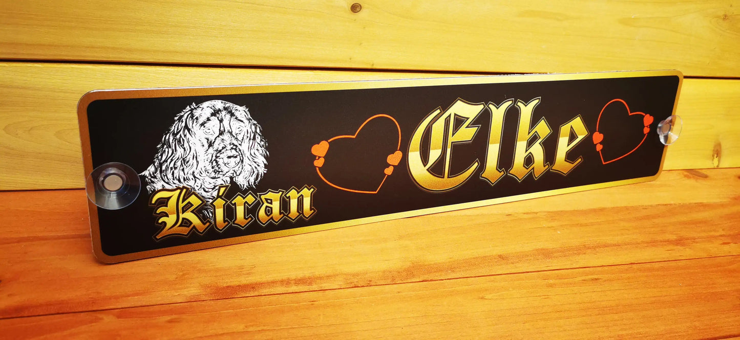 Personalized truck nameplate with dog illustration and hearts on aluminum panel.