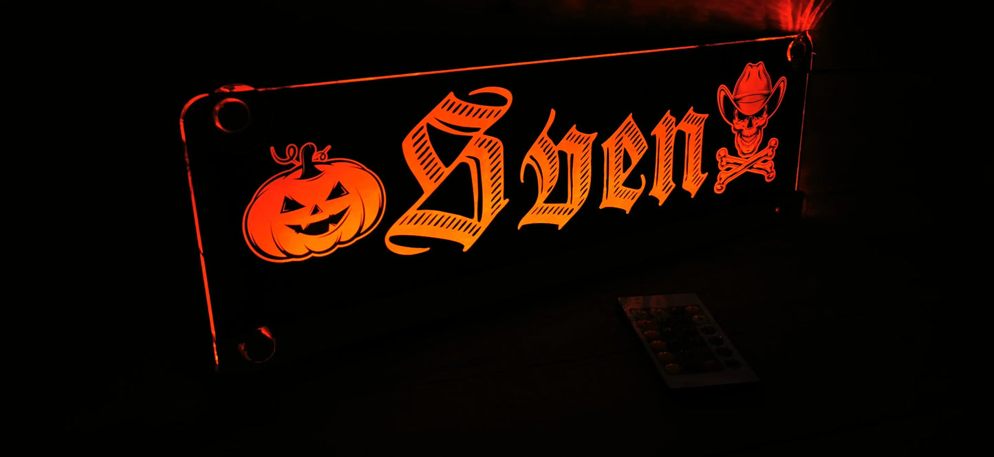 Illuminated LED truck nameplate with Halloween motifs and custom name design.