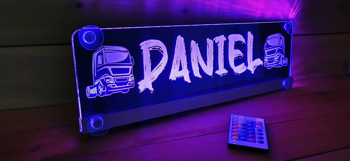 Illuminated LED nameplate with suction cups for trucks, featuring customizable design and remote control, glowing in vibrant blue.