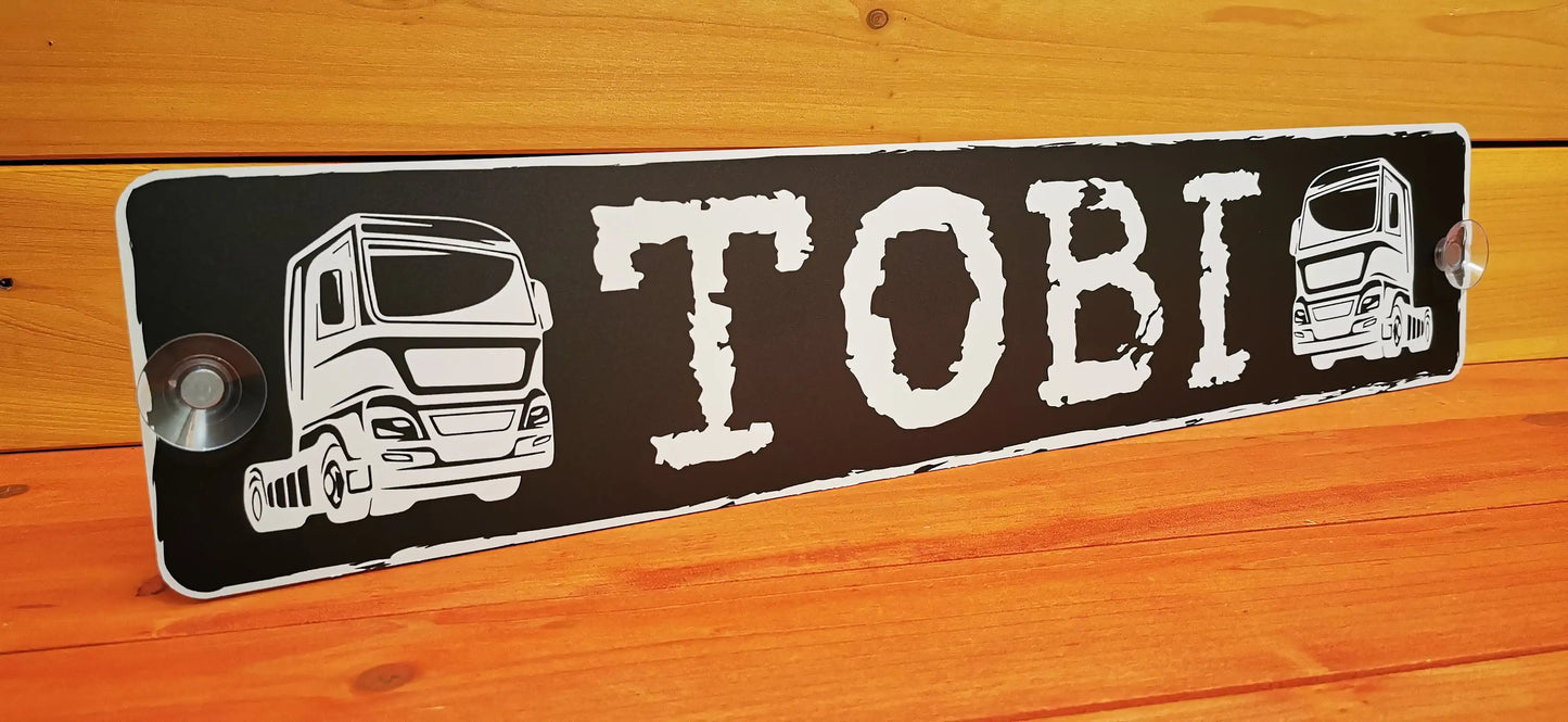Custom LKW truck nameplate with 'TOBI', printed on 3mm aluminum composite plate with suction cups for attachment to windshield.