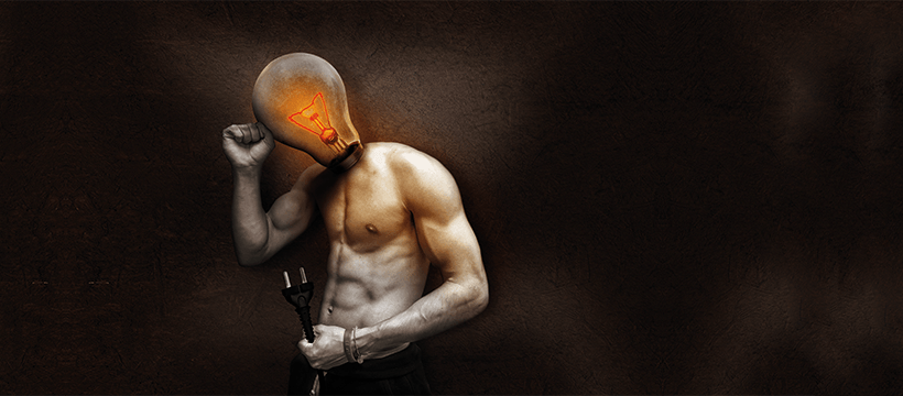 Light bulb head with muscular body holding a plug, symbolizing innovative thinking and energy in business success.
