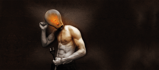Light bulb head with muscular body holding a plug, symbolizing innovative thinking and energy in business success.