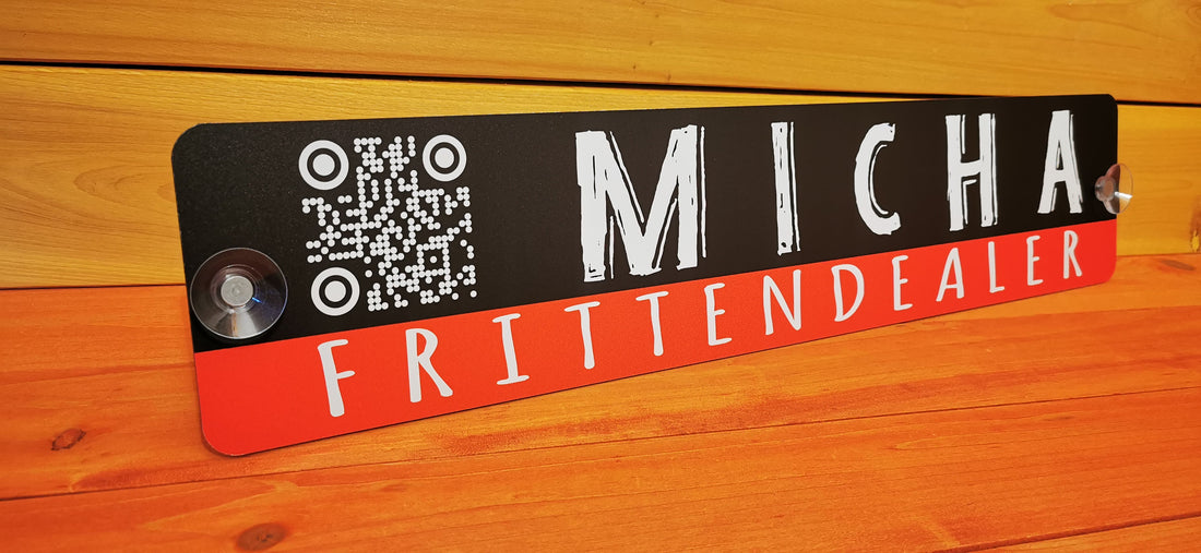 Custom LKW sign with QR code and text 'Micha FrittenDealer' on wood background.