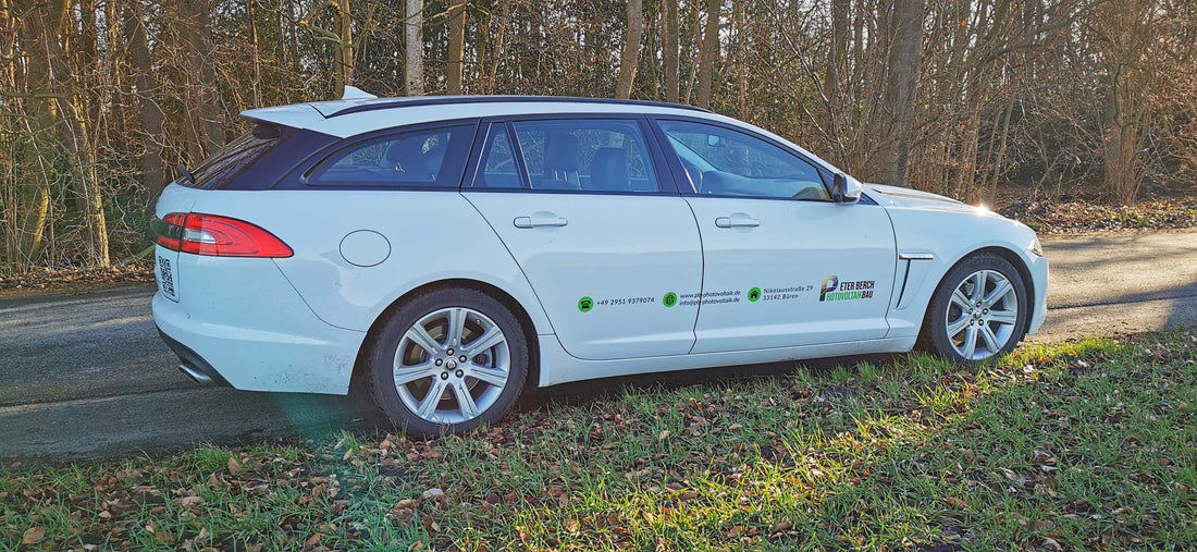 Company vehicle with custom branding parked on a rural road