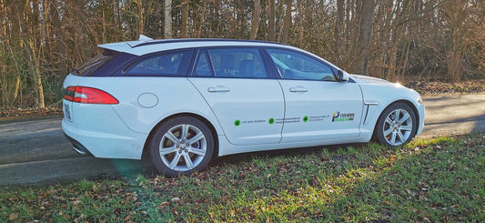 Company vehicle with custom branding parked on a rural road