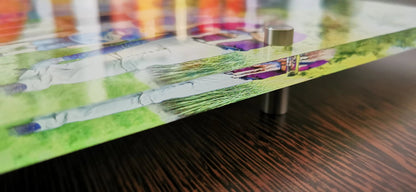 Close-up of an acrylic photo gift plaque on a wooden table, showcasing vibrant colors and modern design.