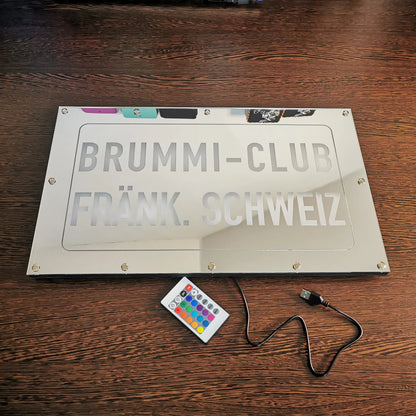 Custom LKW mirror back panel with remote, featuring RGB-LEDs and personalized engraving for Brummi-Club Fränk. Schweiz.