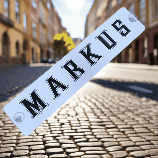 B-Ware LKW-Namensschild 'MARKUS' on cobbled street, with two suction mounts; reduced price and minor imperfections possible.