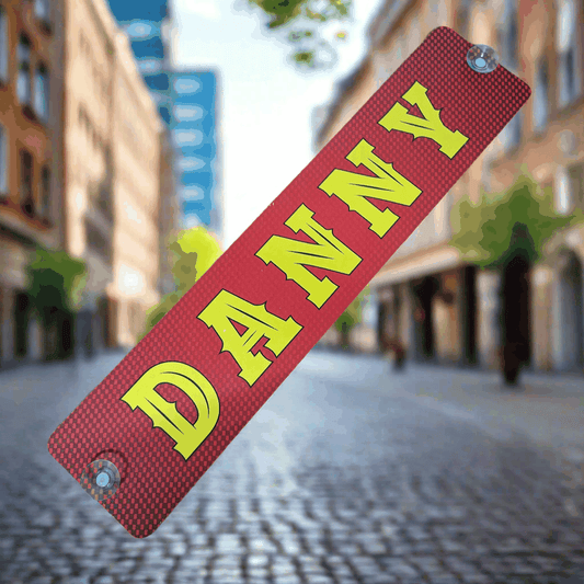 LKW Namensschild mit "DANNY"-Aufschrift in gelb auf rotem Hintergrund, B-Ware zum Sonderpreis, Alu-Verbundplatte mit Saugnäpfen.