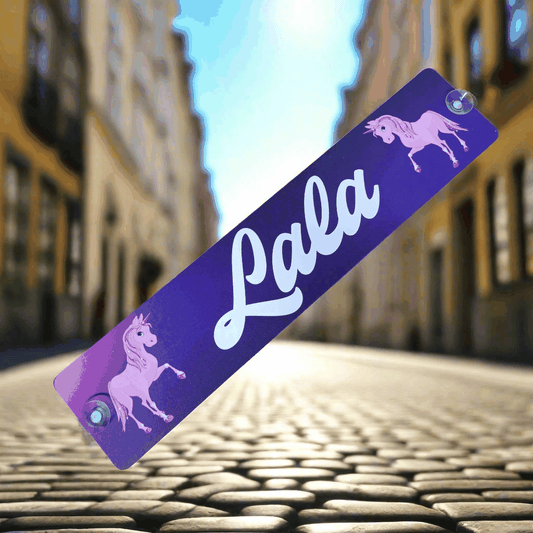 Purple LKW-Namensschild with 'Lala' and unicorn graphics, featuring suction cups for easy mounting.