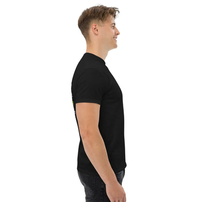 Model wearing a black classic men's T-shirt made from 100% cotton, side view. Ideal for layering with a structured look.