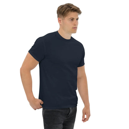 Model wearing a classic men's T-shirt in dark navy, 100% cotton, showcasing a structured look perfect for layering and casual wear.