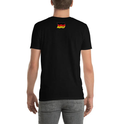 Back view of person wearing black T-shirt with German flag design on upper back, paired with grey jeans
