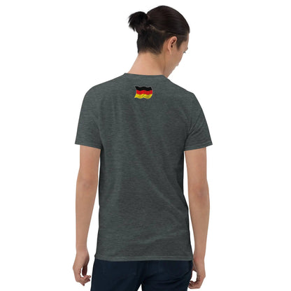 Person wearing a dark heather unisex T-shirt with "Asphaltkrieger" design, showing the back with a small German flag detail, casual fit.