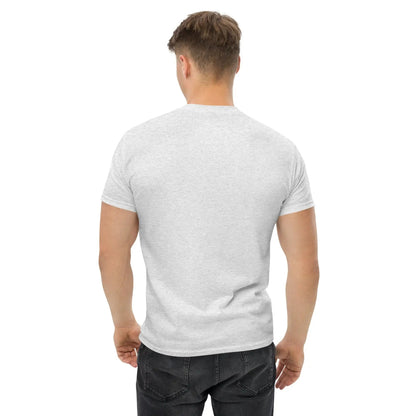 Back view of a man wearing a plain white short-sleeve T-shirt with black jeans, showcasing the fit and style from behind.