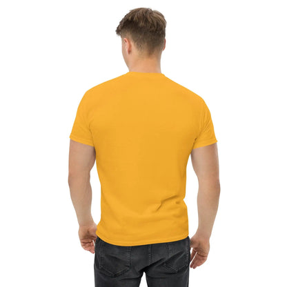 Back view of a man wearing a plain yellow T-shirt and black jeans, showcasing the T-shirt fit and style.