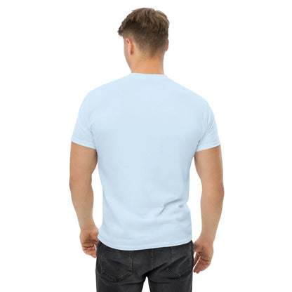 Back view of a man wearing a light blue T-shirt, standing against a white background.