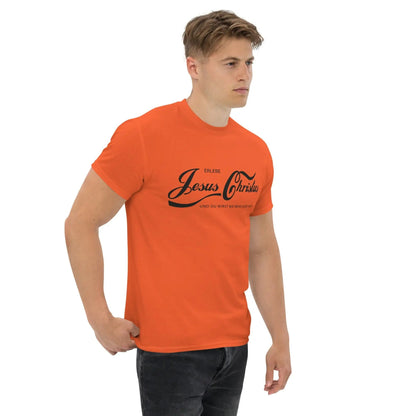 Person wearing an orange T-shirt with 'Erlebe Jesus Christus und du wirst nie mehr Durst haben' printed, cotton fabric, faith statement.