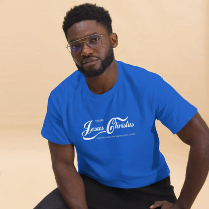 Man wearing blue T-shirt with 'Erlebe Jesus Christus und du wirst nie mehr Durst haben' text, seated in casual pose.