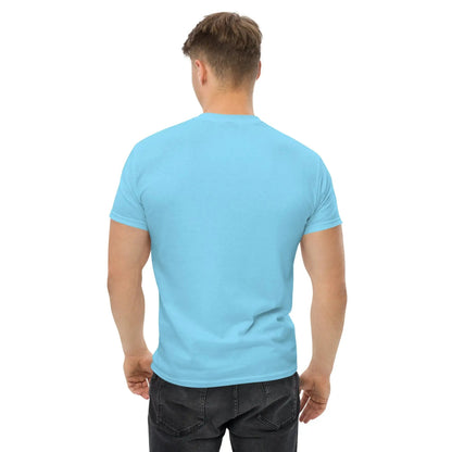 Back view of a model wearing a light blue T-shirt paired with dark jeans.