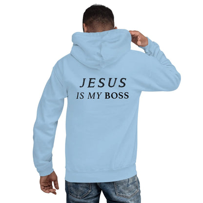 Man wearing light blue hoodie with 'JESUS IS MY BOSS' print, showcasing faith through fashion.