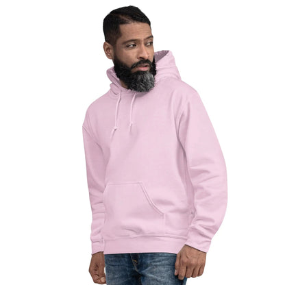 Person wearing a light pink hoodie with "JESUS IS MY BOSS" print, showcasing faith and style.