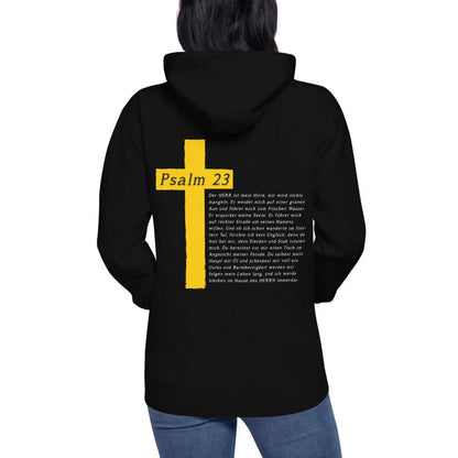 Hoodie with Psalm 23 motif featuring a yellow cross on the back, worn by a person, blending style and inspirational message.