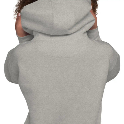 Back view of gray hoodie with hood up on person, highlighting fabric texture