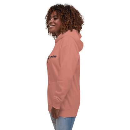 Woman wearing a hoodie with "geliebt gerettet" and cross design, featuring comfortable cotton-poly blend and kangaroo pocket, side view.