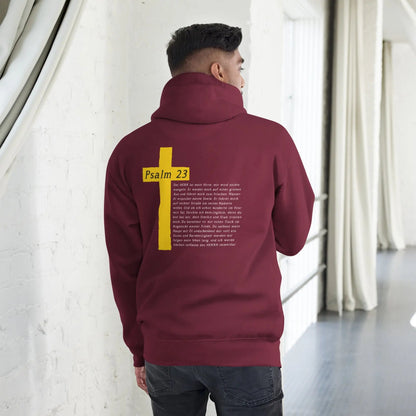 Man wearing a maroon hoodie with Psalm 23 cross design on the back, showcasing comfort and spiritual style.