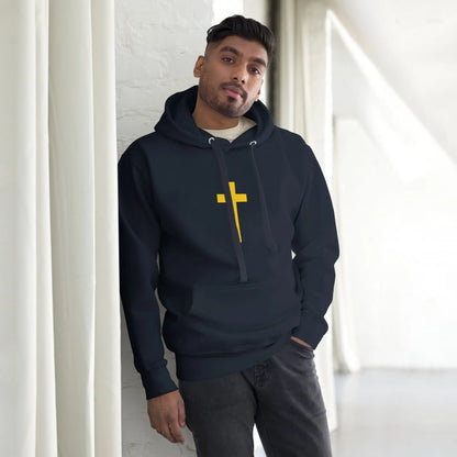 Man wearing a black hoodie with a yellow cross design, featuring Psalm 23 on the back, standing in a bright room.
