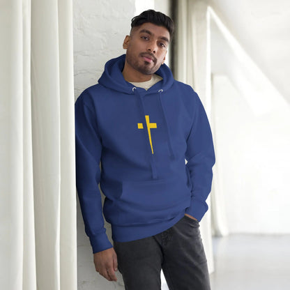 Man wearing a blue hoodie with a yellow cross and Psalm 23 design, standing casually indoors.