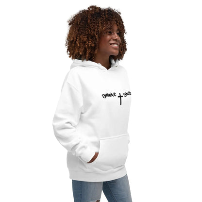 Woman wearing a white hoodie with 'geliebt gerettet' and a cross print, showcasing comfort and style with a kangaroo pocket.