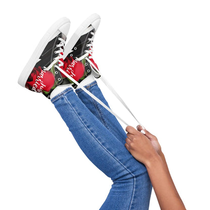 Woman tying laces on 'Just Married' high-top sneakers, perfect for adding style and comfort to wedding day attire.