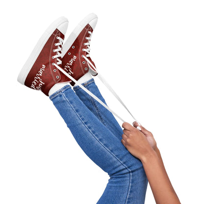 Pair of red 'Just Married' sneakers for women, stylish and perfect for weddings, worn with blue jeans.