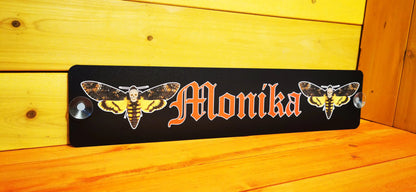 Individually designed LKW Namensschild with custom motif "Monika" printed on aluminum composite with suction cups.