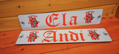 Custom LKW truck nameplates featuring 'Ela' and 'Andi' with stylish red lettering and suction cups for windshield attachment.