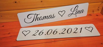 Personalized wedding car license plates with names and date, featuring hearts on Alu-Dibond for wedding photoshoot embellishment.