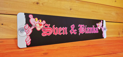 Custom LKW nameplate with "Sven & Bianka" design, featuring a pink cartoon character on aluminium composite for truck windscreen.