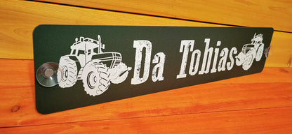 Personalized LKW Namensschild with tractor design and suction cups for front windshield, featuring the name 'Da Tobias'.