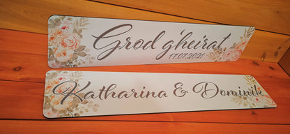 Elegantly designed wedding car license plates with floral accents and personalized text for a unique wedding decoration.