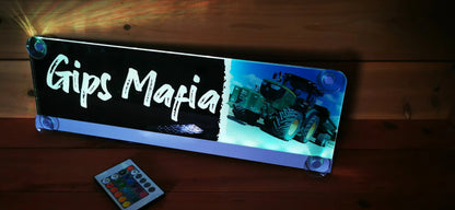 Illuminated LED truck nameplate with remote control and custom design, featuring 'Gips Mafia' text and tractor image.