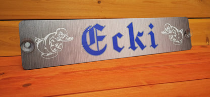 Personalized LKW nameplate with ducks illustration and suction cups, ready for front windshield installation.