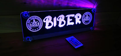 Illuminated LED truck nameplate with custom motif and remote control, displaying 'BIBER' text, ideal for show trucks.