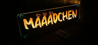 Illuminated LED truck name sign with "MÄÄÄDCHEN" text and heart icons, designed for personalized truck decoration.