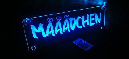 Illuminated LED truck nameplate with suction cups and custom design, featuring the word 'Mädchen' with hearts and glowing blue light.
