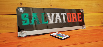 LED truck nameplate with suction cups displaying 'Salvatore' in bold letters, featuring a remote control and customizable design.