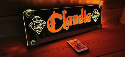 Illuminated LED truck nameplate with suction cups displaying custom design and remote control, ideal for personalization.